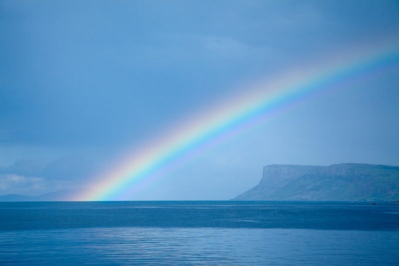 Rainbow across Fair Head, County Antrim, Northern Ireland.