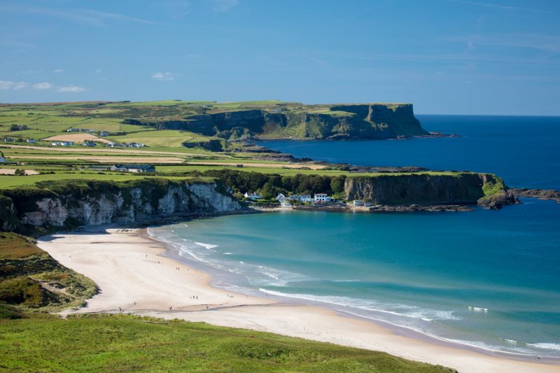 View across White Park Bay and Portbraddan, Causeway Coast, County Antrim, Northern Ireland.