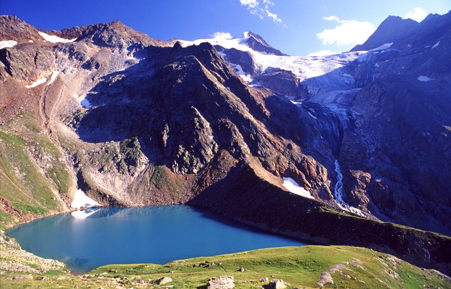 The Grunasee and Wilder Freiger, Stubai Hohenweg, Stubai Alps, Austria. The Grunasee and Wilder Freiger, Stubai Hohenweg, Stubai Alps, Austria.