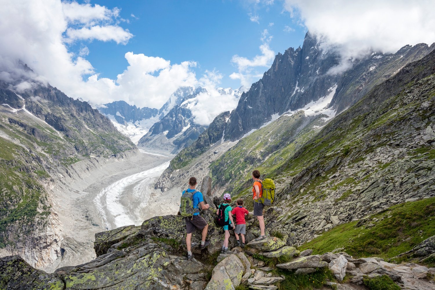 Hiking family above Mer de Glace glacier, Chamonix Valley, French Alps, France. Hiking family above Mer de Glace glacier, Chamonix Valley, French Alps, France.