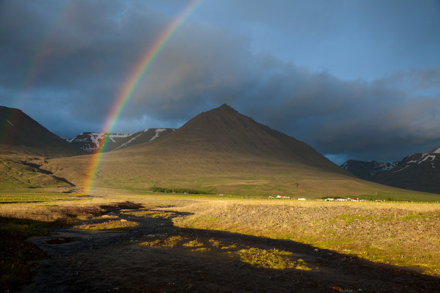Evening rainbow over the Heradsvotn valley, Varmahlid, Skagafordur, Nordhurland Vestra, Iceland. Evening rainbow over the Heradsvotn valley, Varmahlid, Skagafordur, Nordhurland Vestra, Iceland.