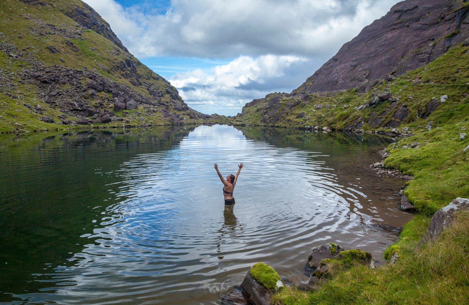 Swimming in Lough Cummeenoughter beneath Carrauntoohil. MacGillycuddy's Reeks, County Kerry, Ireland. Swimming in Lough Cummeenoughter beneath Carrauntoohil. MacGillycuddy's Reeks, County Kerry, Ireland.