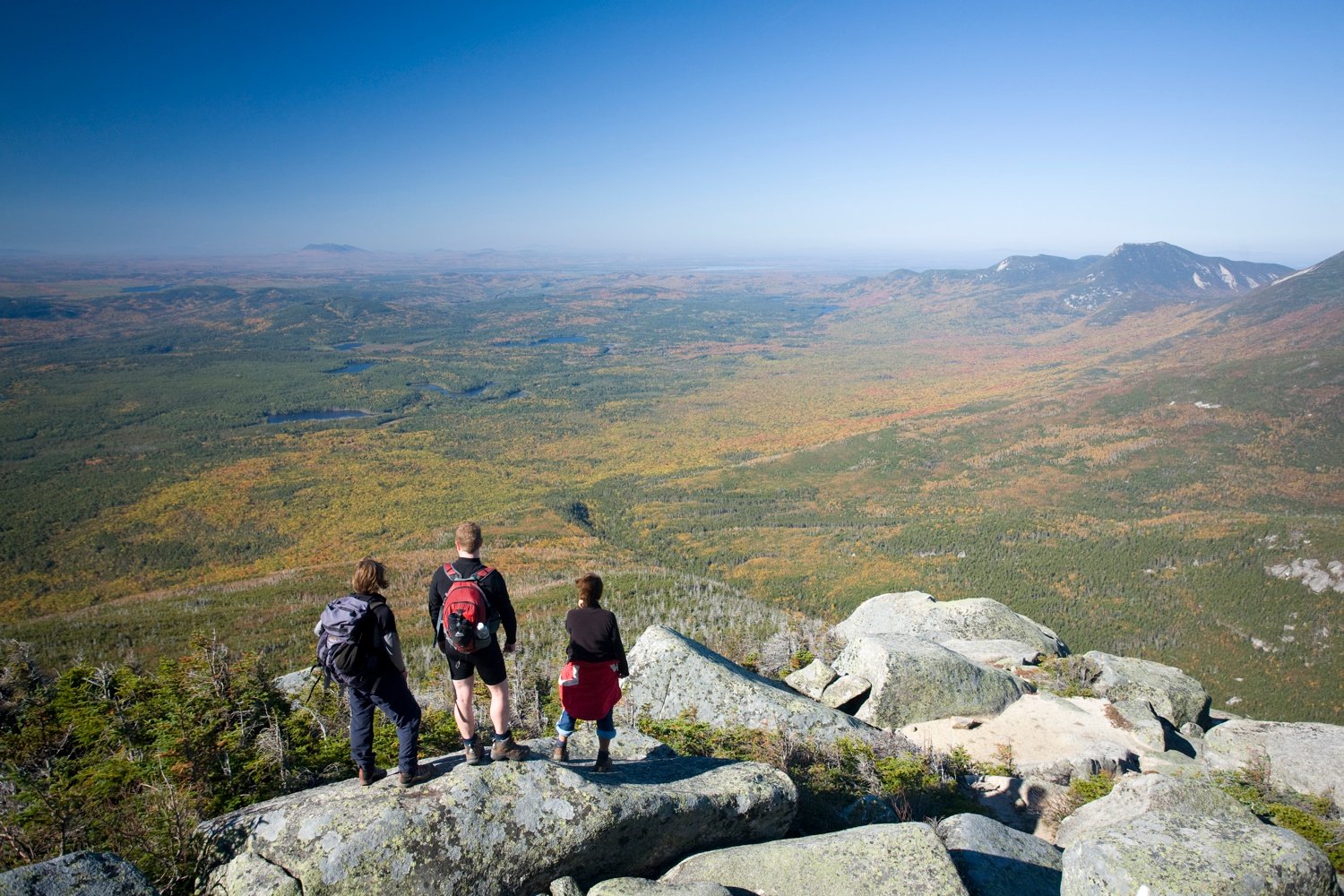 Hikers looking out from Mount Katadhin, Baxter State Park, Maine, USA. Hikers looking out from Mount Katadhin, Baxter State Park, Maine, USA.