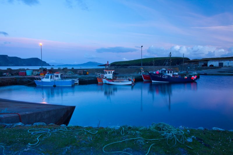 Evening fishing boats at Purteen Harbour, Achill Island, Co Mayo, Ireland.