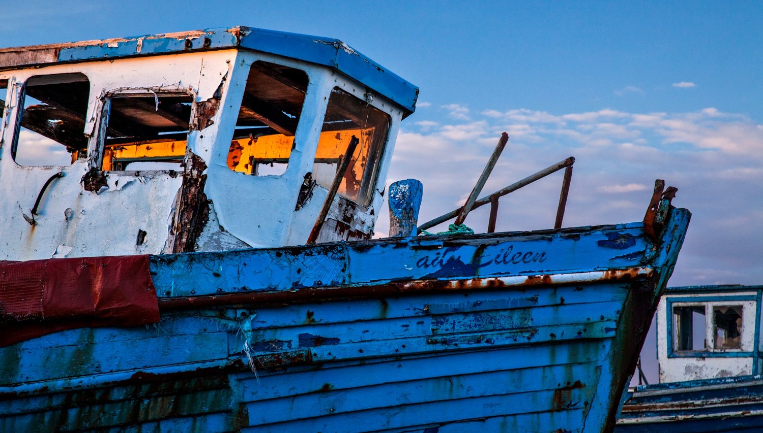 Evening light on an old fishing boat, Killala, County Mayo, Ireland. Evening light on an old fishing boat, Killala, County Mayo, Ireland.