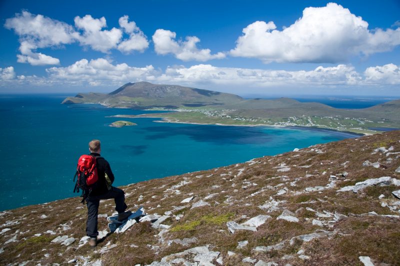 Walker on the Menawn Cliffs, Achill Island, Co Mayo, Ireland.
