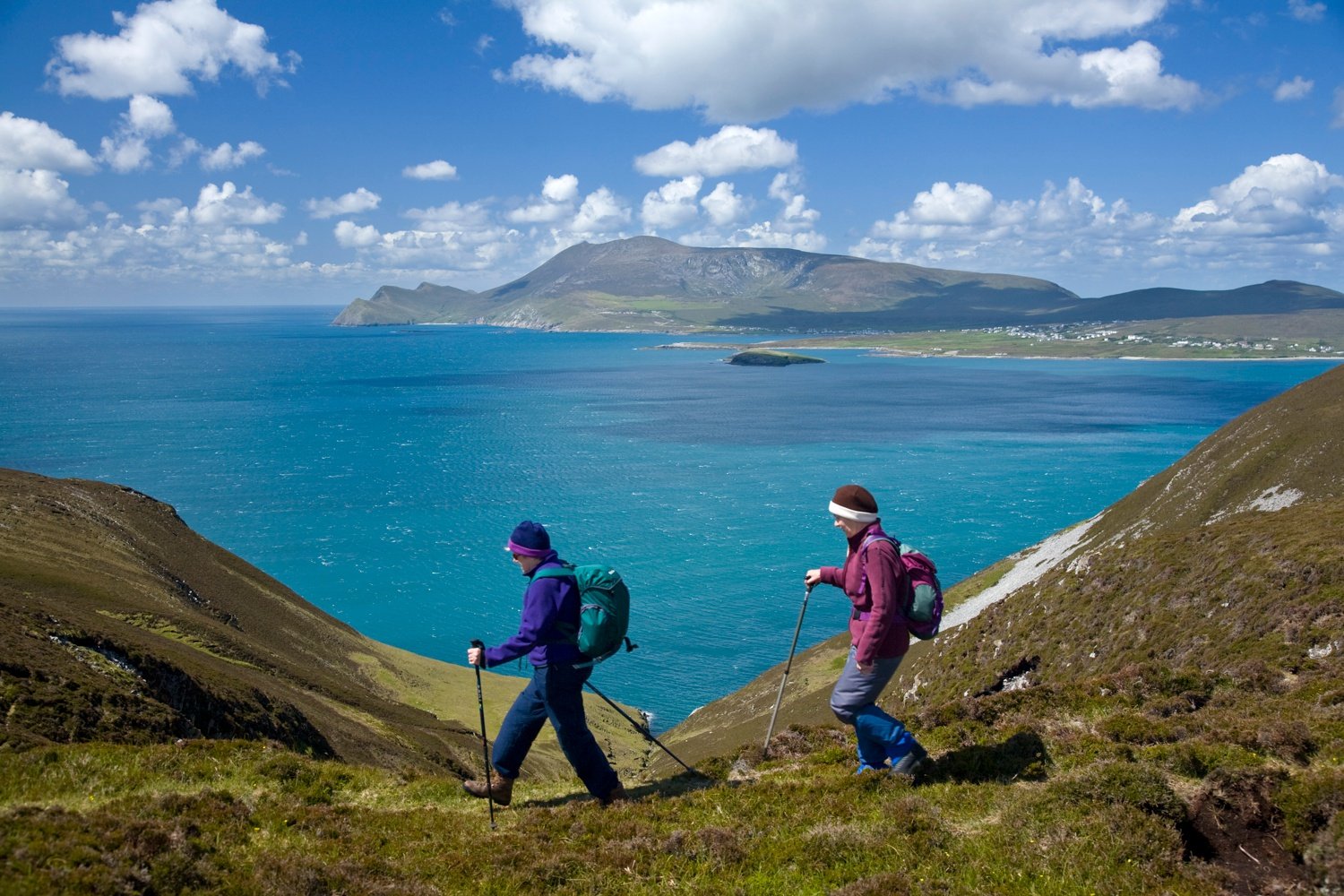 Walkers on the Menawn Cliffs, Achill Island, Co Mayo, Ireland. Walkers on the Menawn Cliffs, Achill Island, Co Mayo, Ireland.