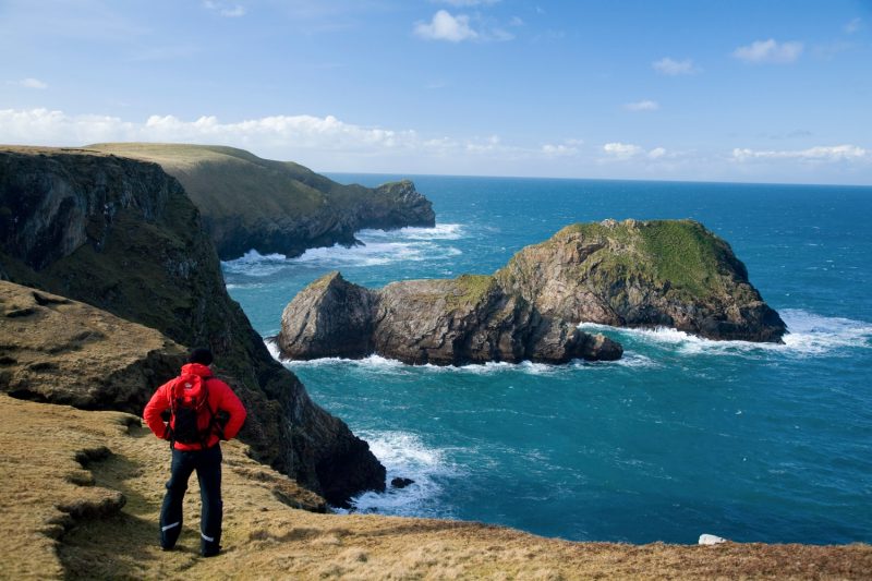 Walker on the North Mayo Seacliffs, near Carrowteige, Co Mayo, Ireland.