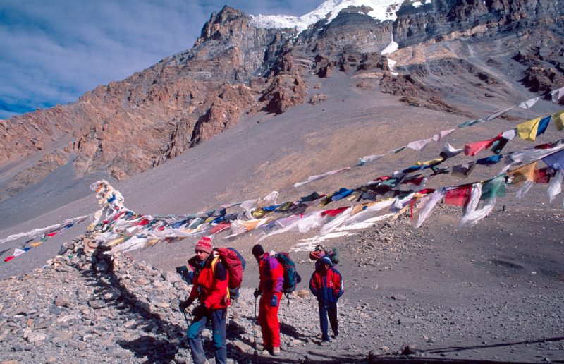 Trekkers at the top of Thorung La (5415m), Annapurna Circuit, Nepal.