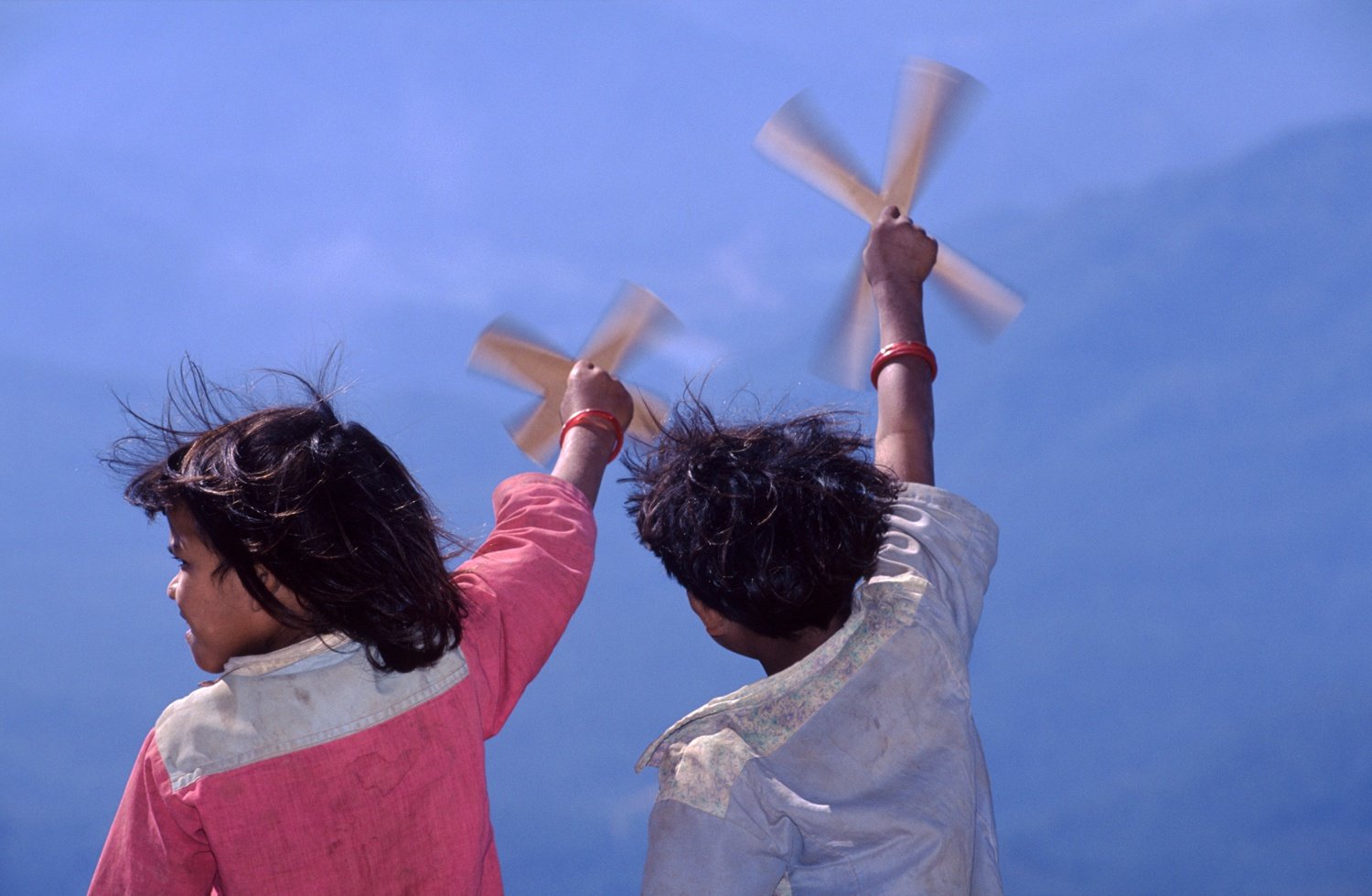 Tharu children with windmills, western Nepal. Tharu children with windmills, western Nepal.