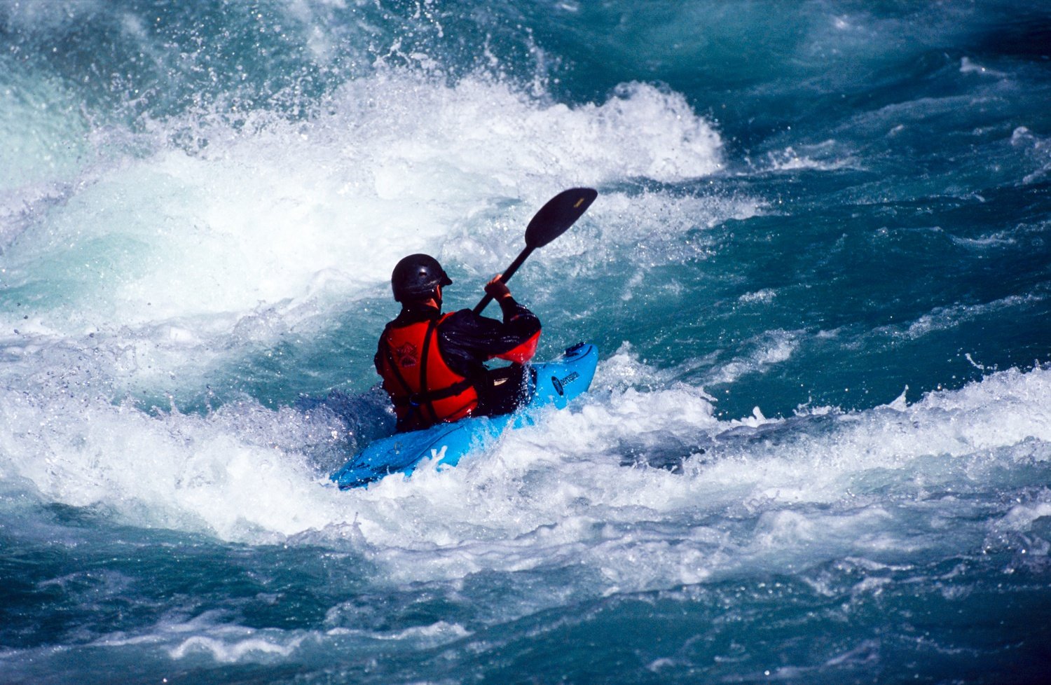 Kayaker on the Karnalli River, Western Nepal. Kayaker on the Karnalli River, Western Nepal.